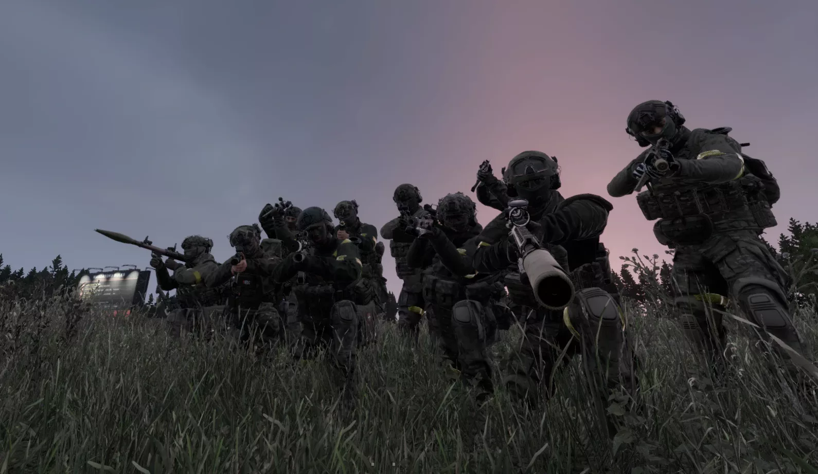 D.A.G.R. squad advancing up a hill at dusk