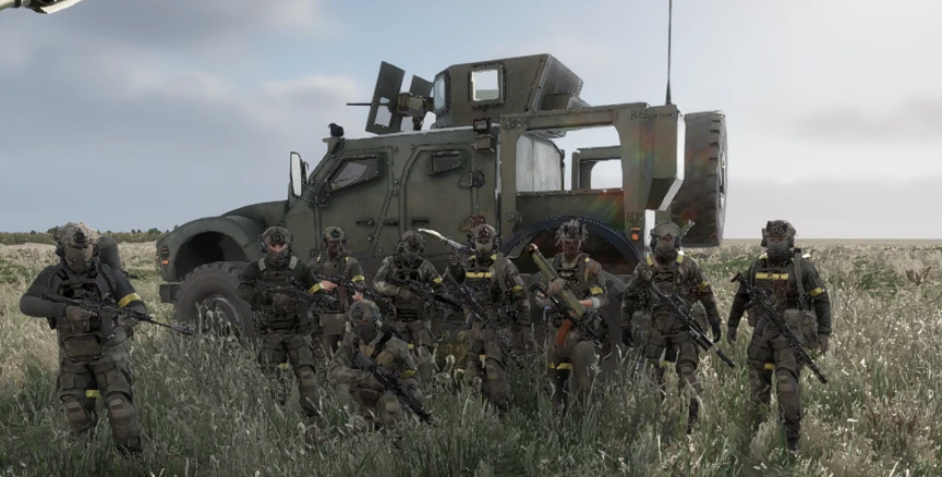 Squad lined up in front of an MRAP